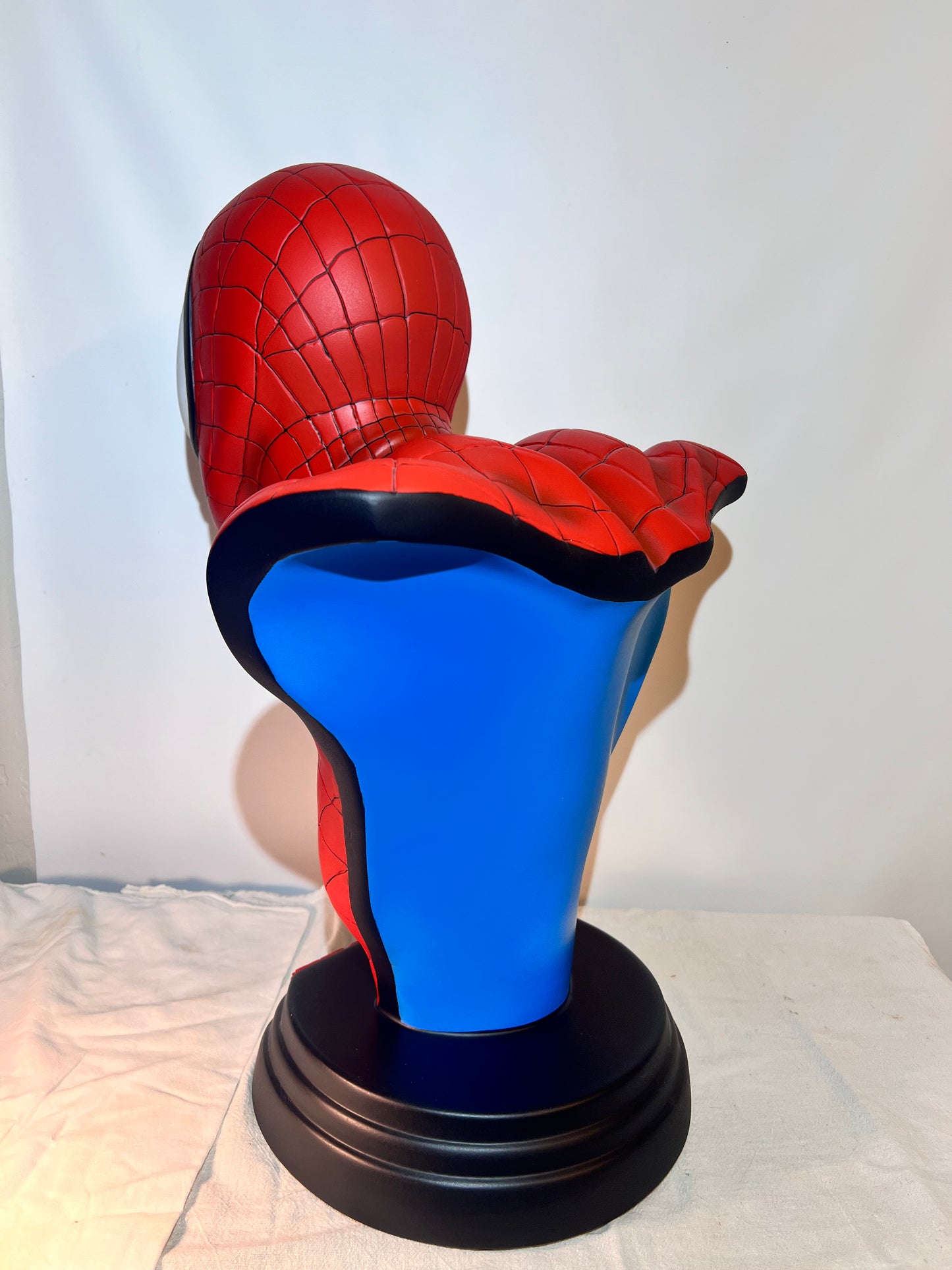 Spider Man- 21.5” bust- Red Suit, black spider, Blue back- Black base with Spider Man logo- Hollow Plastic Resin