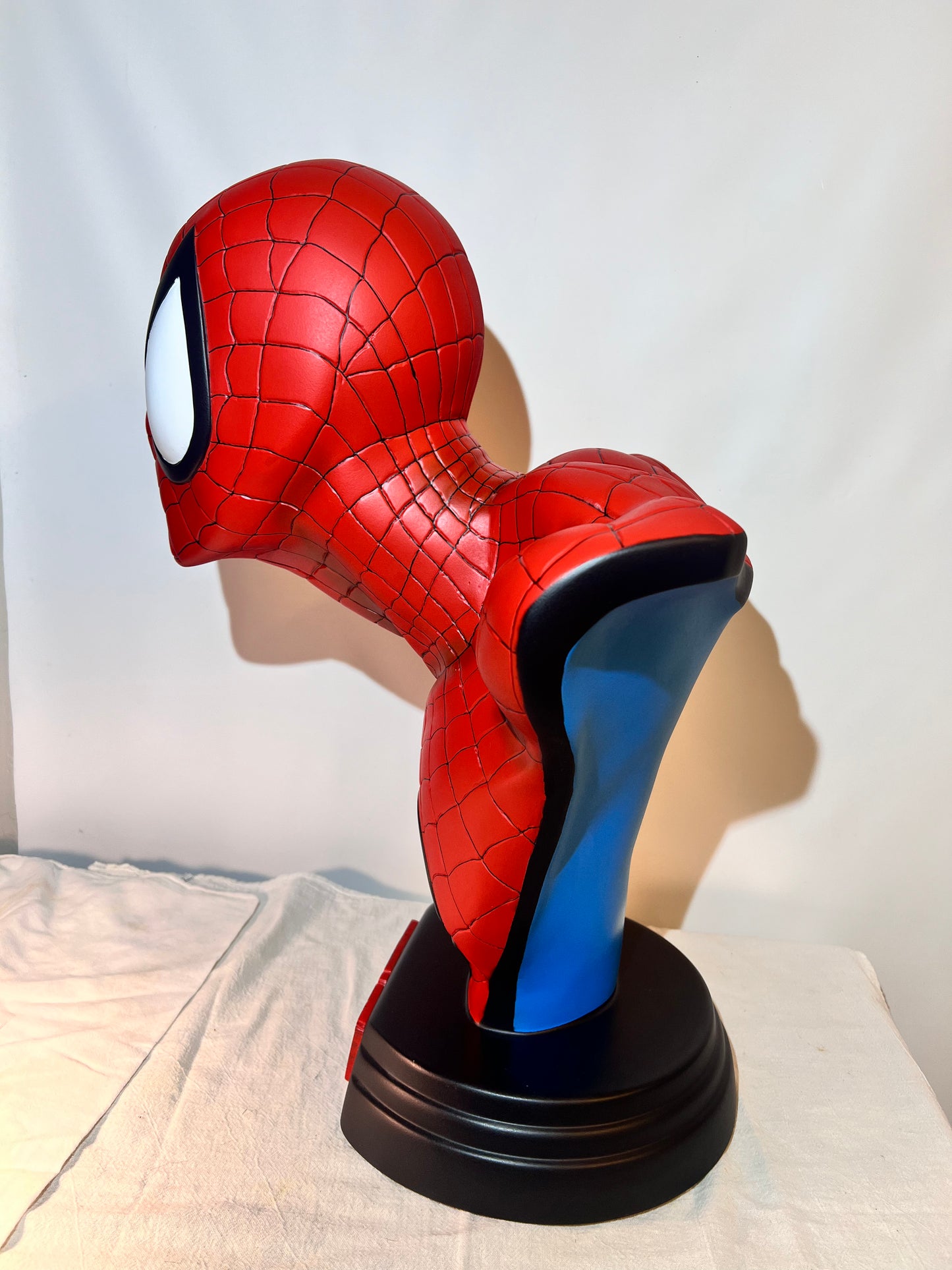 Spider Man- 21.5” bust- Red Suit, black spider, Blue back- Black base with Spider Man logo- Hollow Plastic Resin