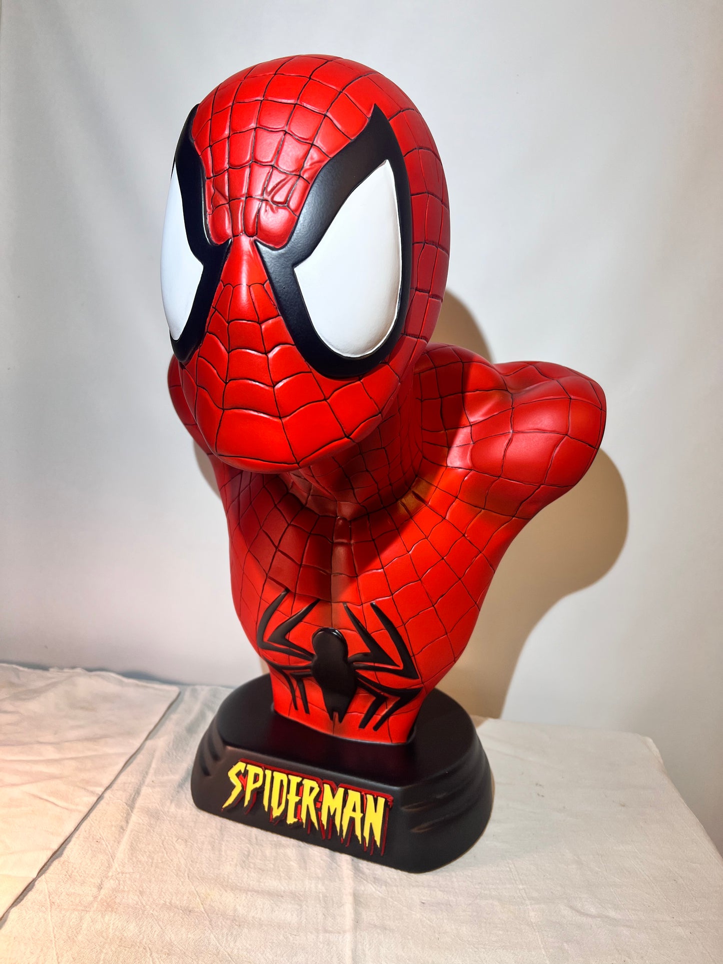 Spider Man- 21.5” bust- Red Suit, black spider, Blue back- Black base with Spider Man logo- Hollow Plastic Resin