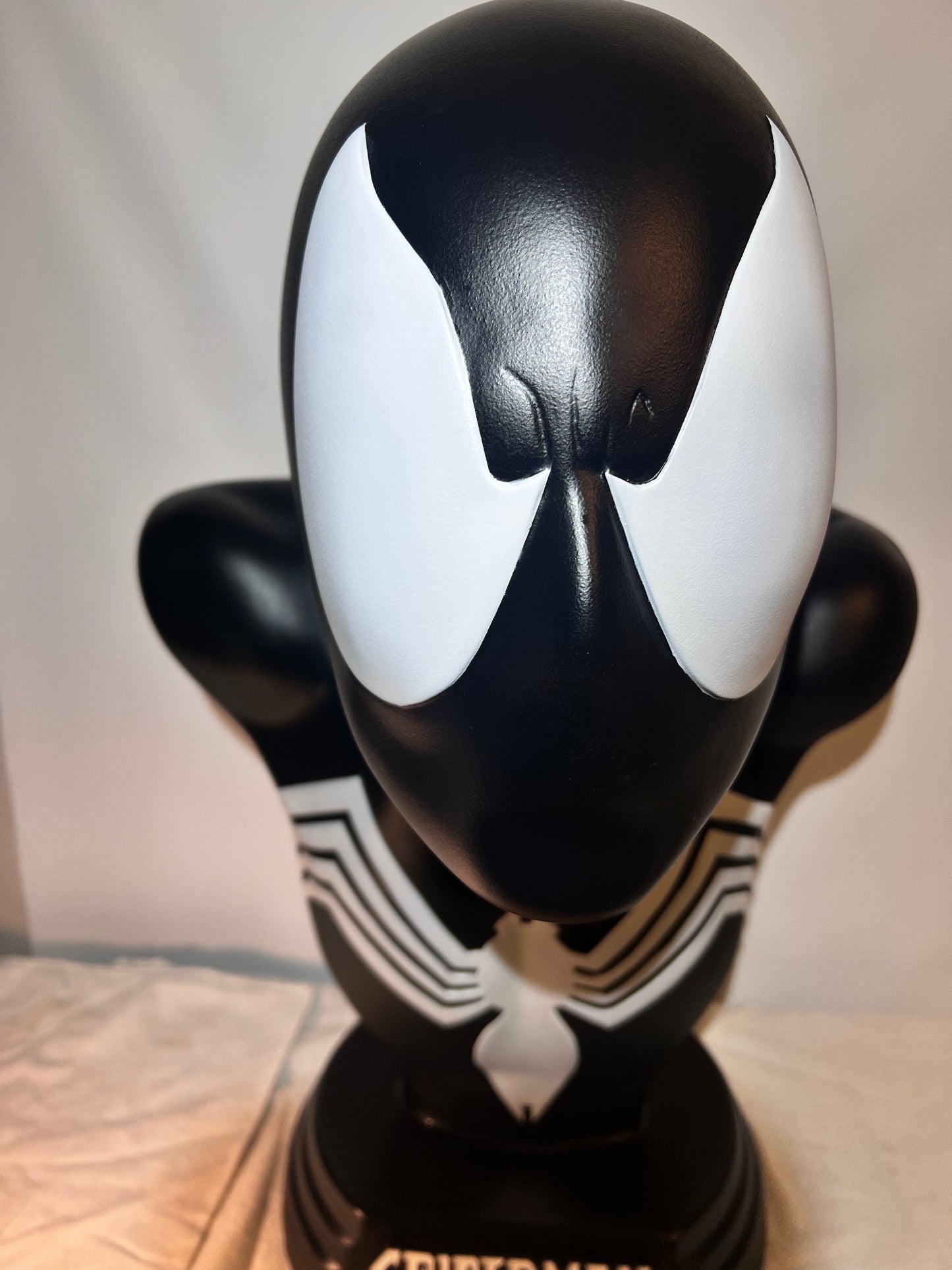 Spider Man- 21.5” bust - Black Suit, light gray spider and eyes- black base with white logo plaque- Hollow plastic resin