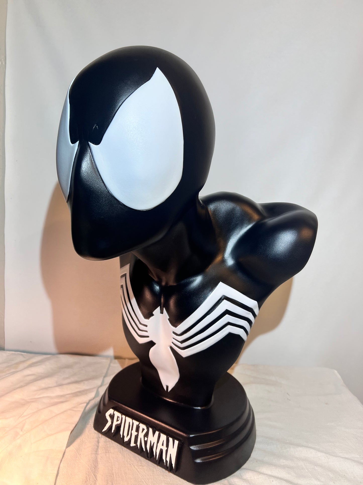 Spider Man- 21.5” bust - Black Suit, light gray spider and eyes- black base with white logo plaque- Hollow plastic resin