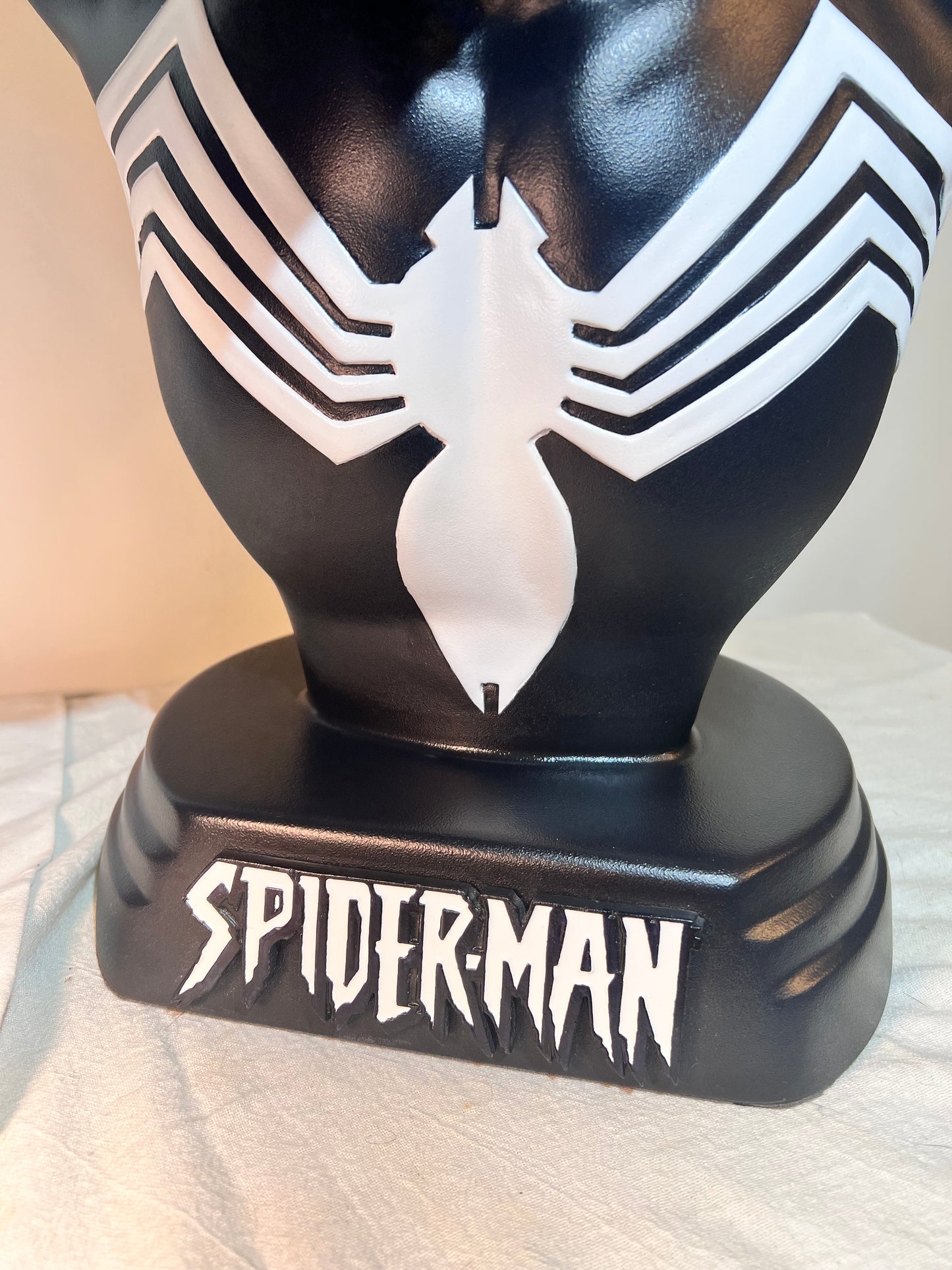 Spider Man- 21.5” bust - Black Suit, light gray spider and eyes- black base with white logo plaque- Hollow plastic resin