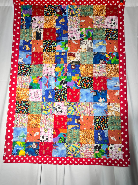 Quilt- fun print squares- 33” x 46” - polkadot trim- kid or baby blanket