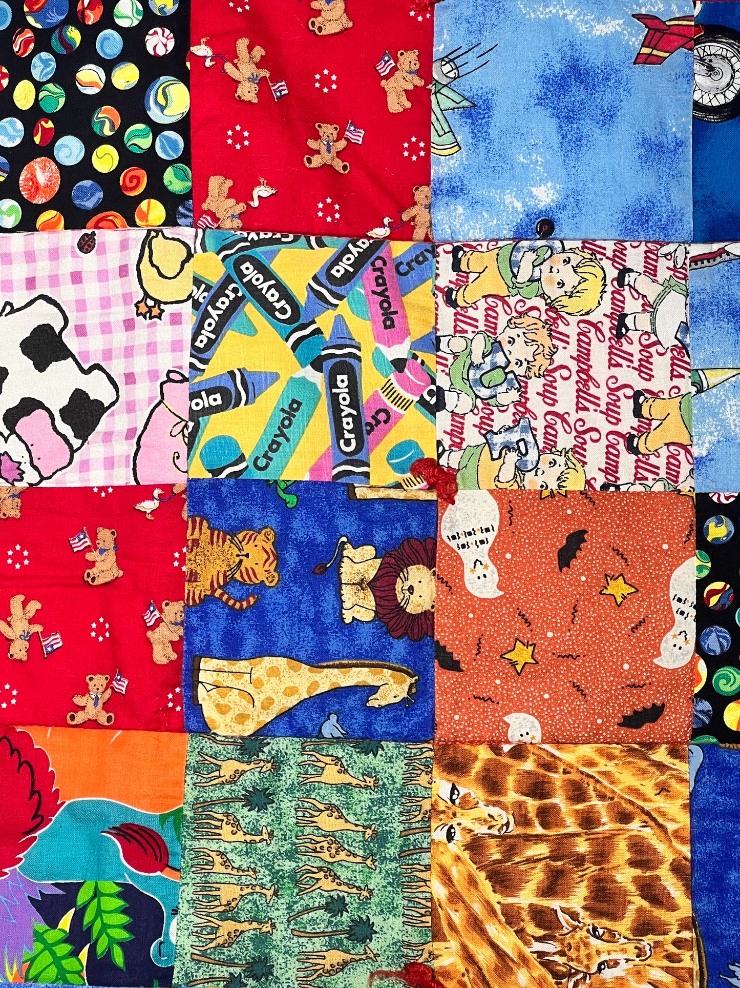 Quilt- fun print squares- 33” x 46” - polkadot trim- kid or baby blanket