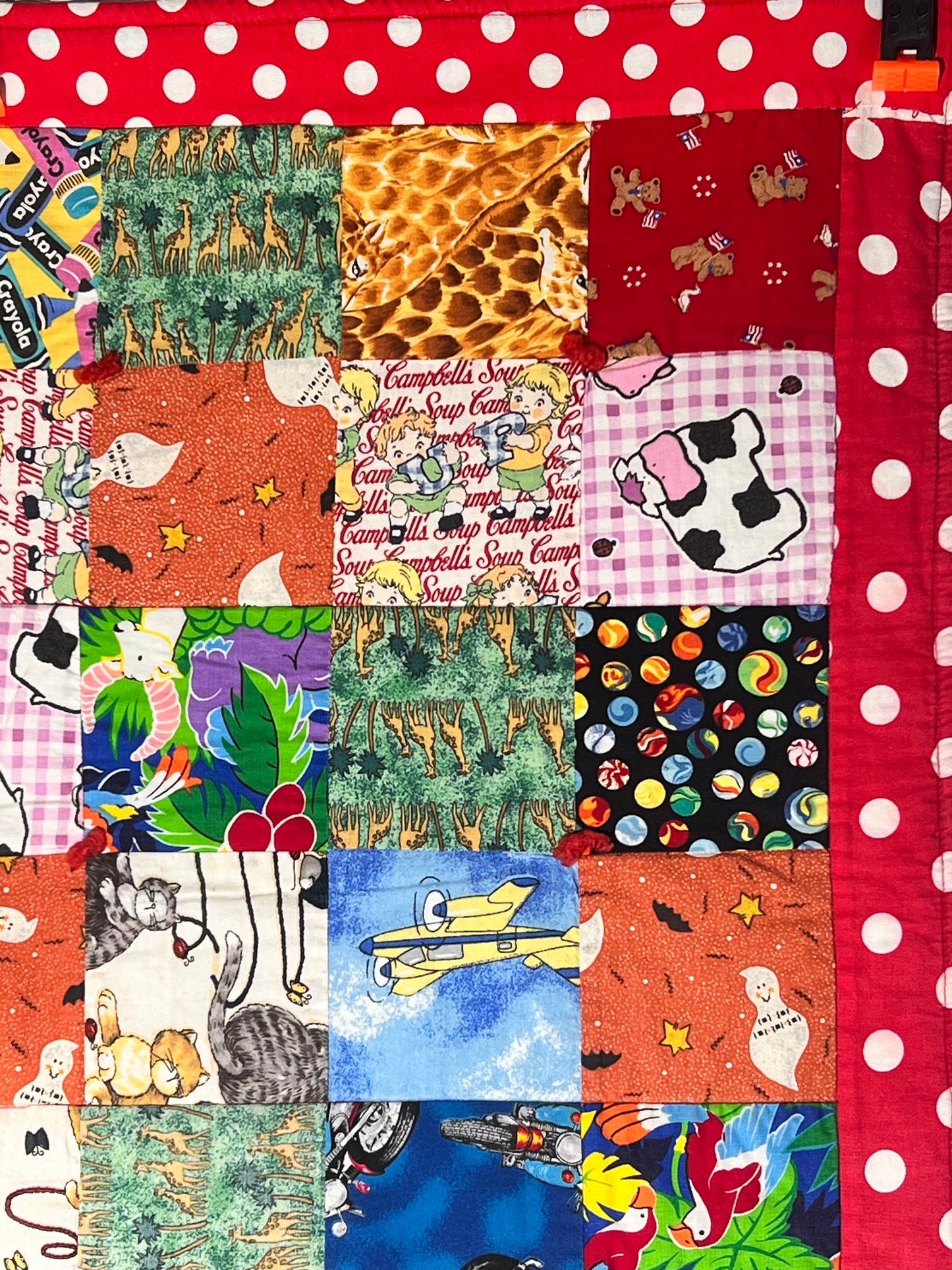 Quilt- fun print squares- 33” x 46” - polkadot trim- kid or baby blanket