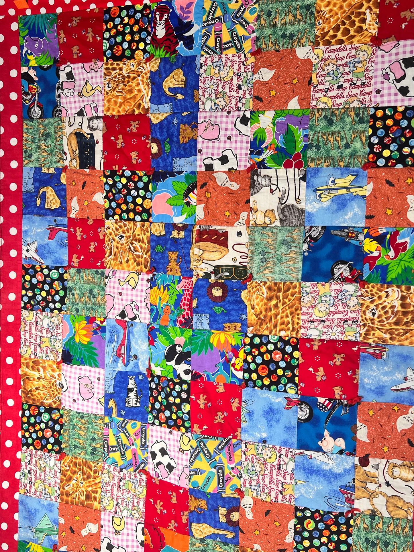 Quilt- fun print squares- 33” x 46” - polkadot trim- kid or baby blanket