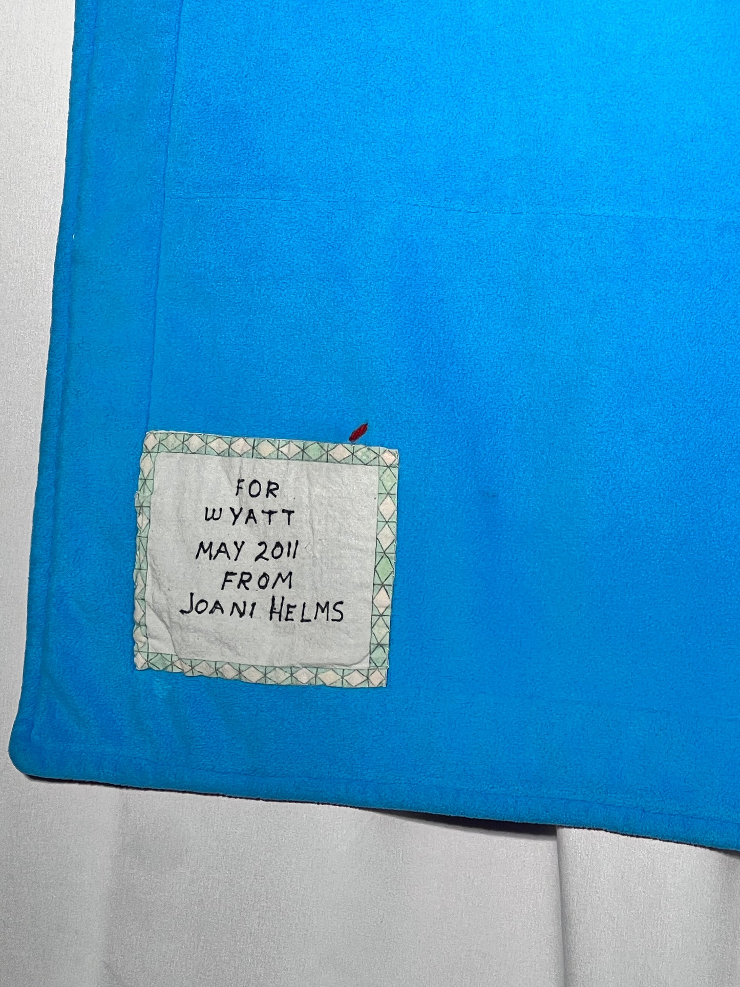 Quilt- fun print squares- 33” x 46” - polkadot trim- kid or baby blanket